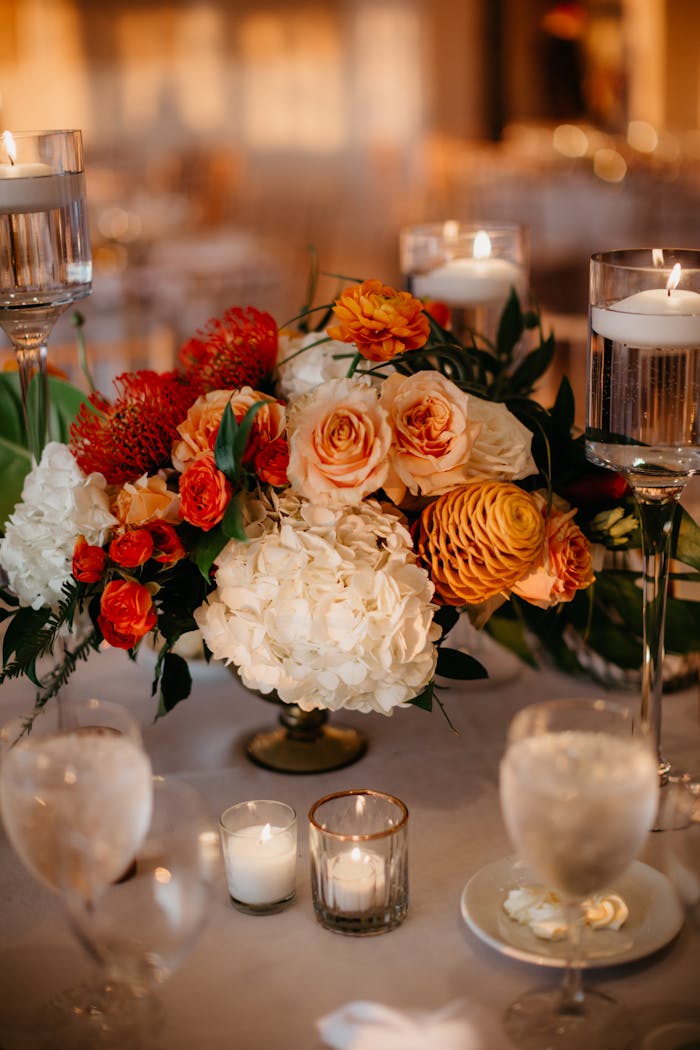 Mastering the First Impression: Your intriguing post title goes here A sophisticated floral centerpiece with candles creates a warm, romantic ambiance.